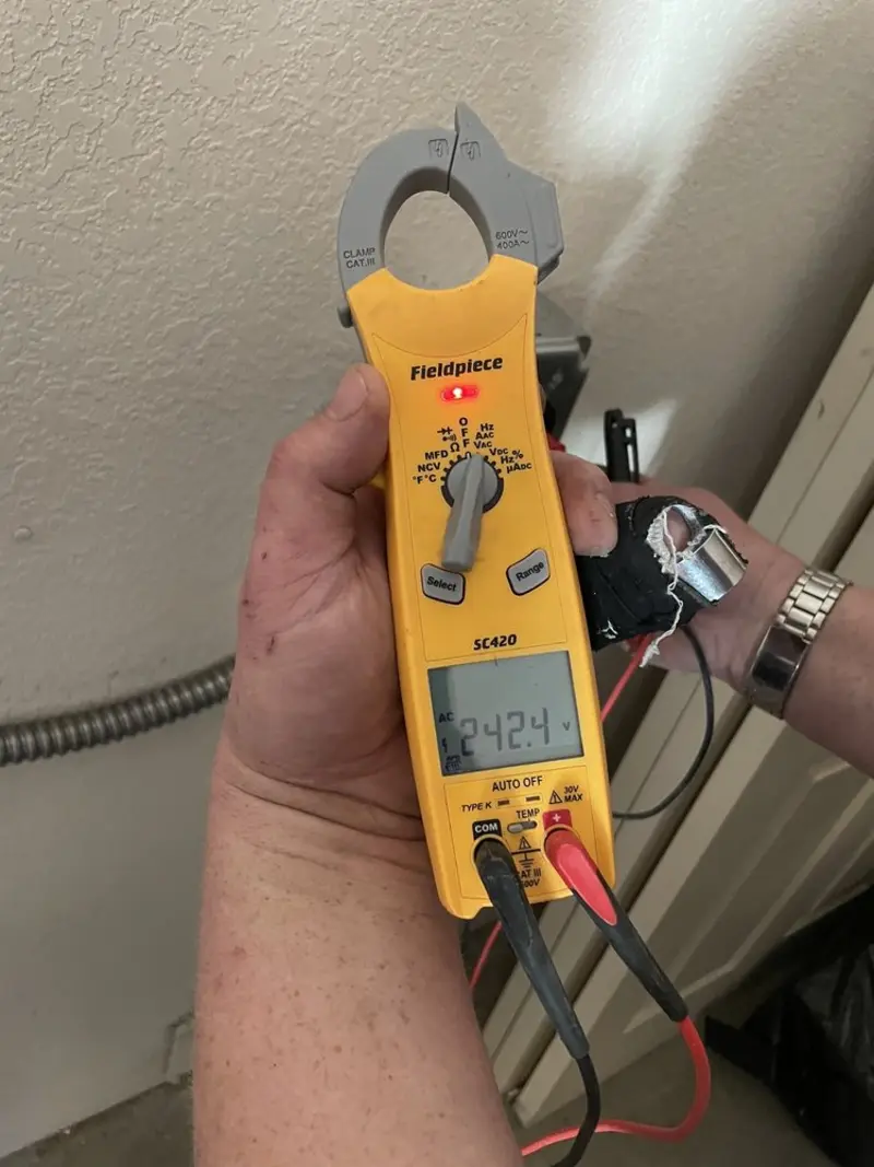 Voltage testing with clamp meter during Electrical Installation Services in Union